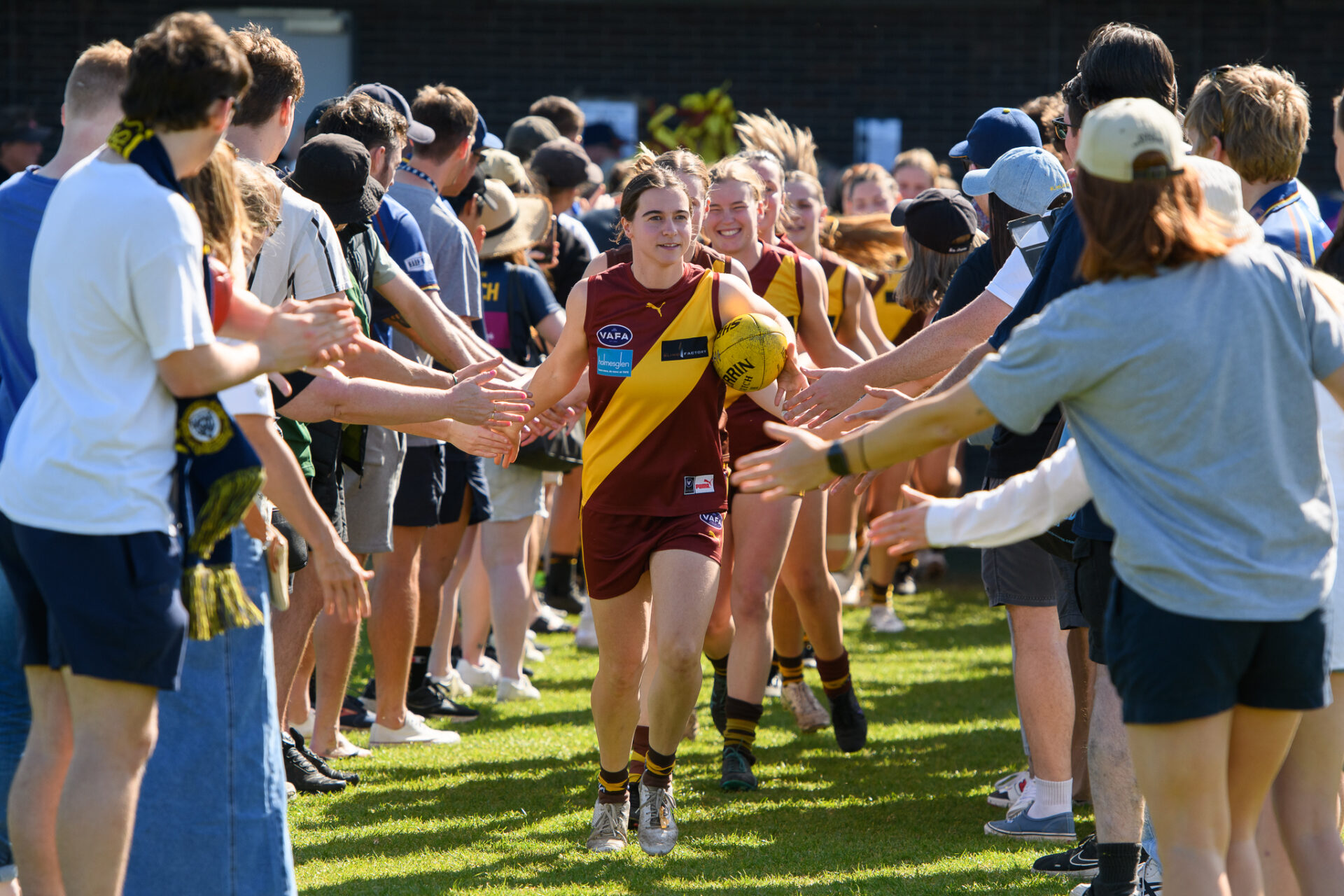 Kew womens seniors running out for the 2023 grand final