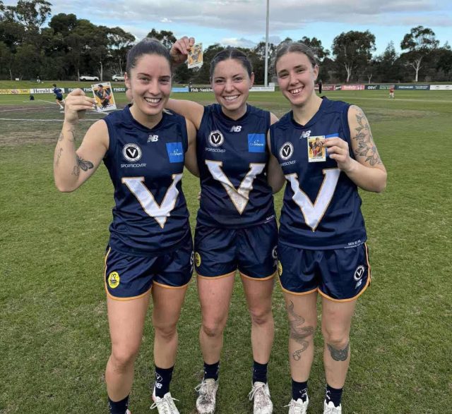 3 Kew Women's players in Big V jumpers after the 2025 game